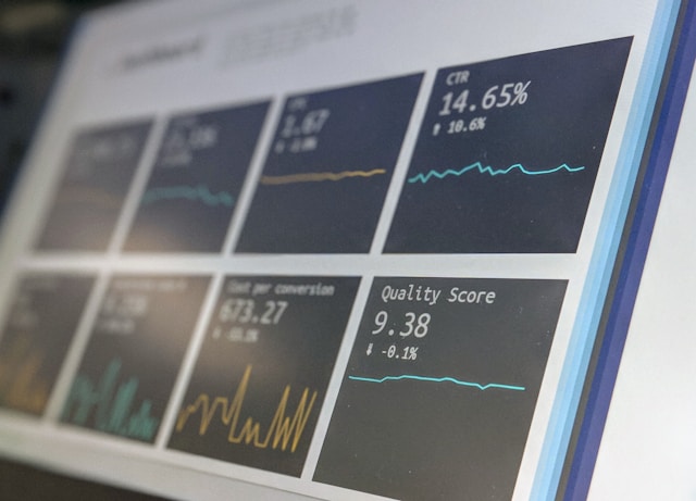 Modern medical data dashboard displaying graphs and compliance metrics on a screen.