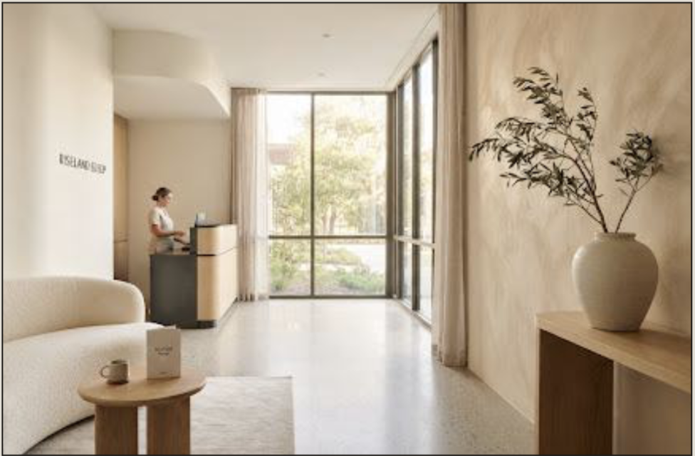 Bright, modern clinic reception desk with large window views.